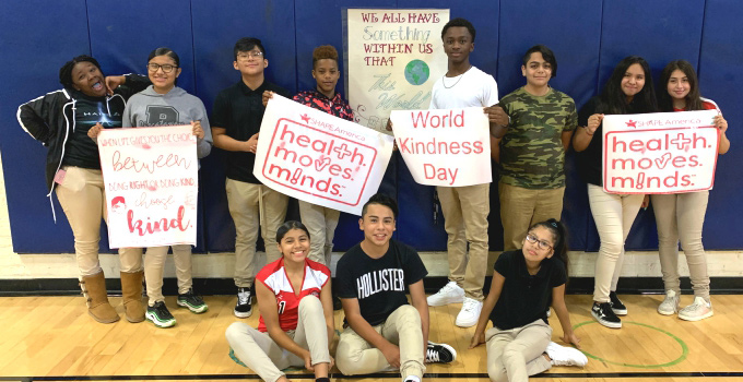 children holding be kind posters health moves minds